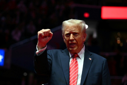 US President-elect Donald Trump reacts during a MAGA victory rally at Capital One Arena in Washington, DC, on January 19, 2025, one day ahead of his inauguration ceremony.